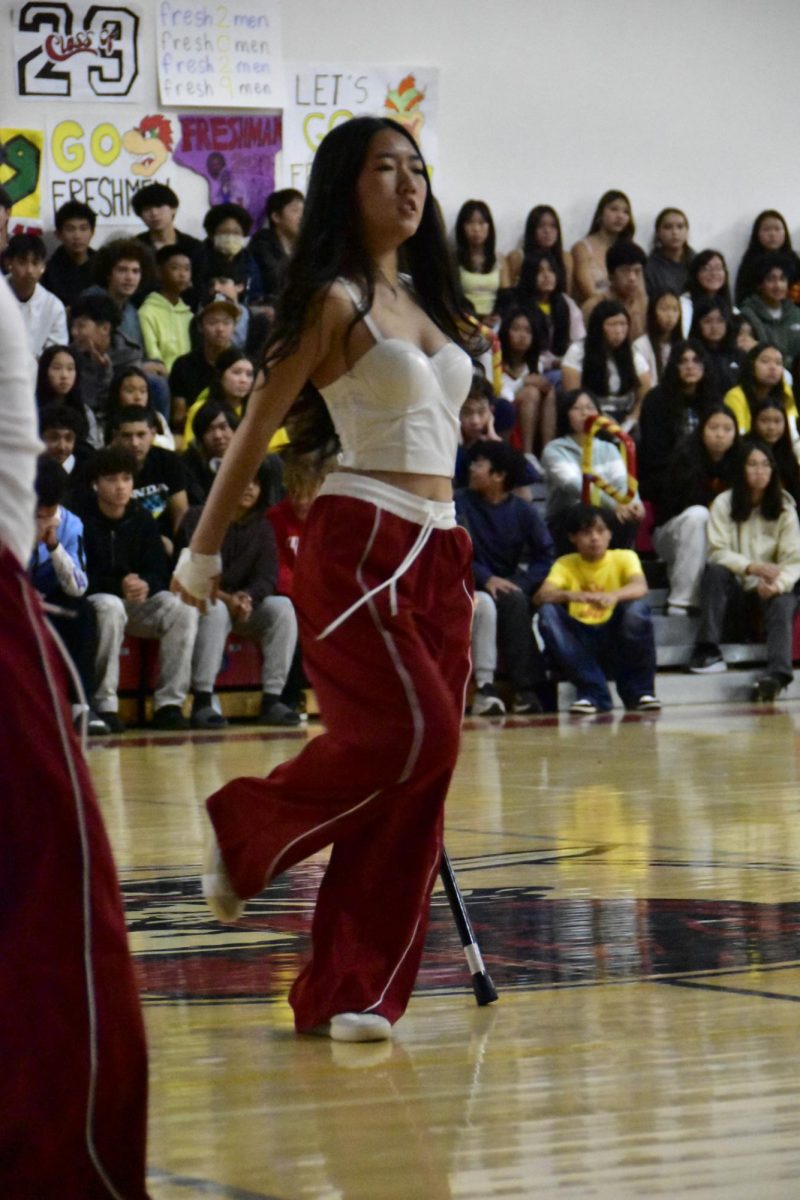 Aislinn Xiao (12) performing for the Mills Dance Club at the Homecoming rally.