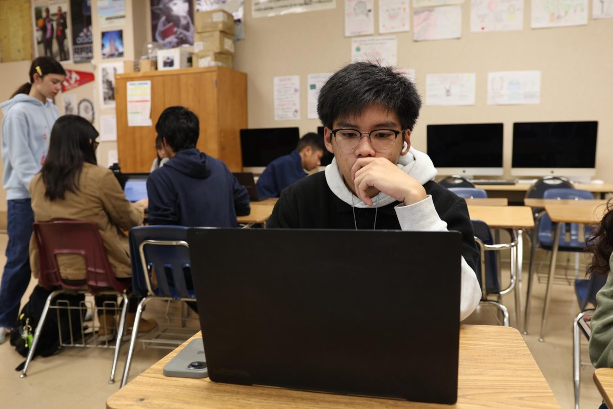 Luis Makilan (12), a first generation college student, works on his applications.