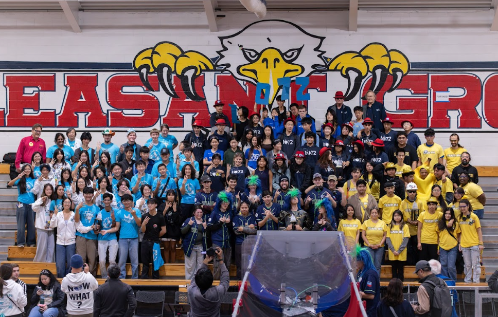 The Boba Bots 253 (left) pose proudly with alliance captains BioMechs 841 (right) and alliance partners Harker Robotics 1072 (top middle) and CTEC Titans 8768 (bottom middle) after winning the competition.