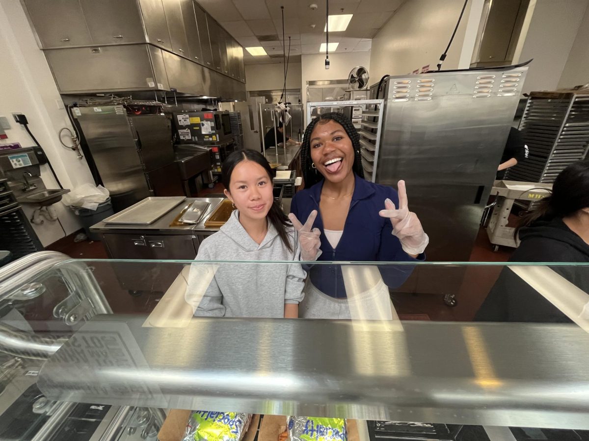 Lauryn (10) and Rachel (10) are serving the hungry students. 