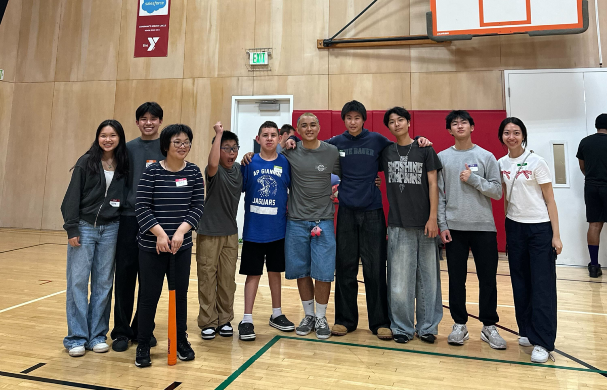LITTLE MIRACLES': Members come together for a group photo with the kids from a club session.