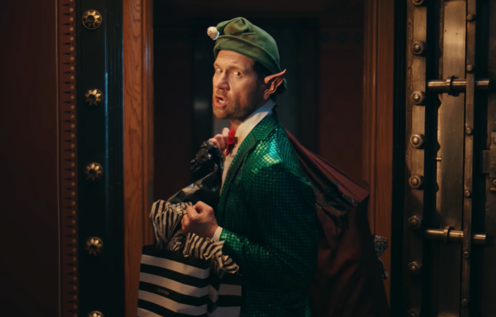 In Mariah Carey's latest "defrosting" video, the elf carries away her Sephora products as he goes on strike. 
(Image courtesy of Mariah Carey on YouTube, "Mariah Carey - It's Time!!!! (2025)" )