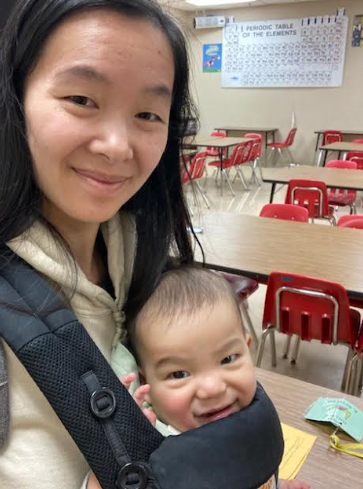 Kiana Reyes with her son taking in one last moment in her classroom before leaving. 
