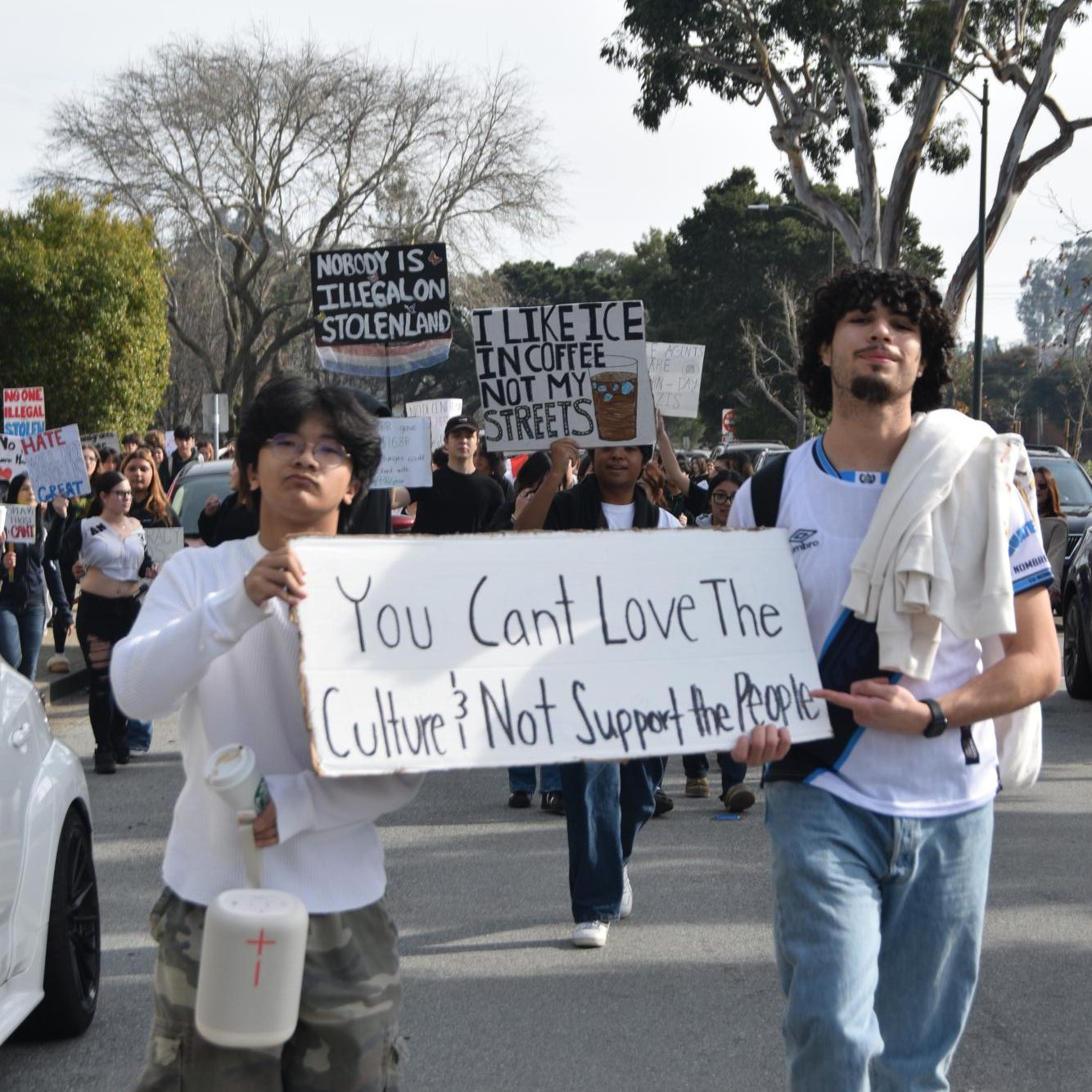 Mills juniors march down the streets of Millbrae acting in solidarity 