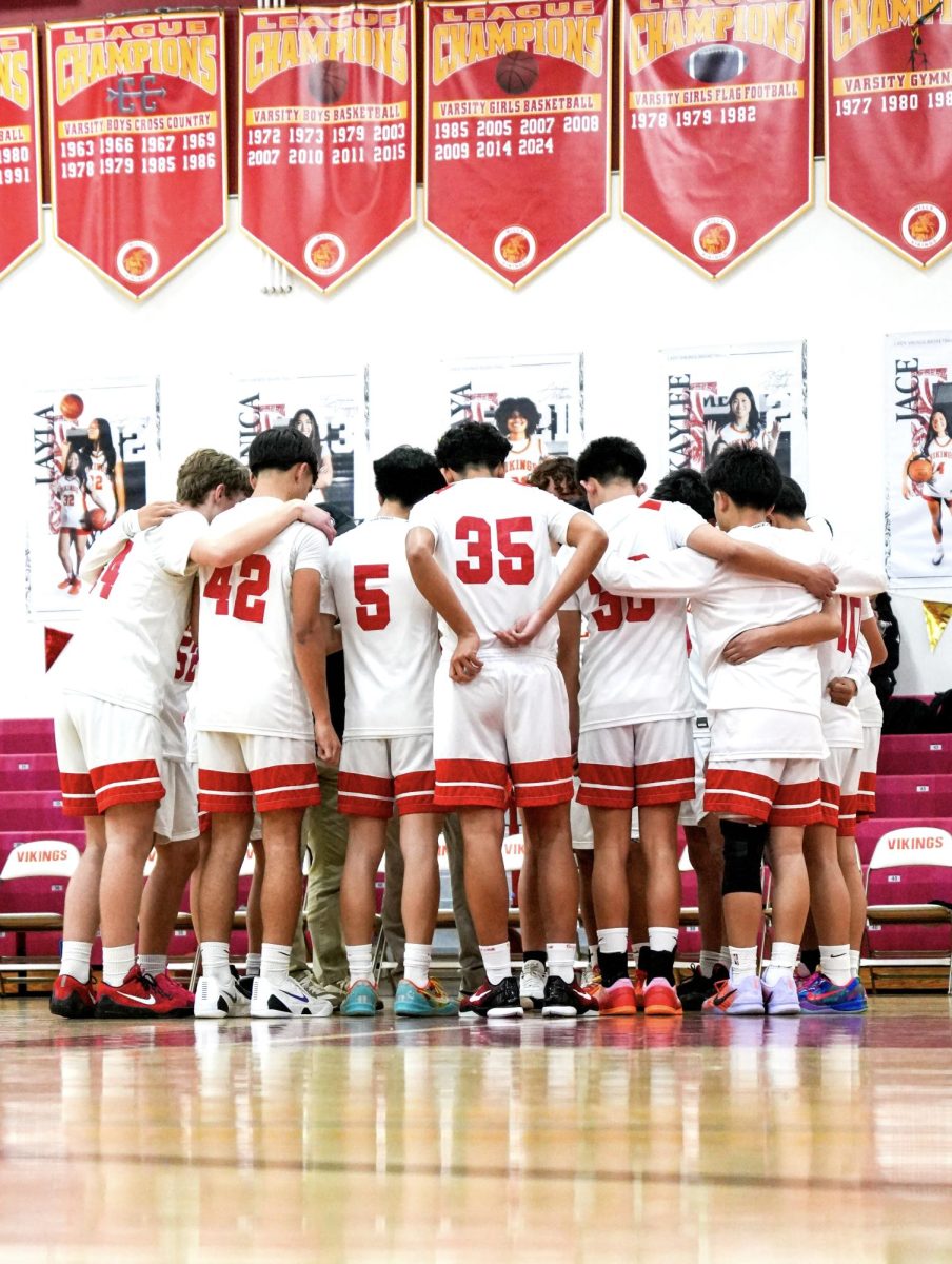JV boys basketball in their pregame huddle before a game 