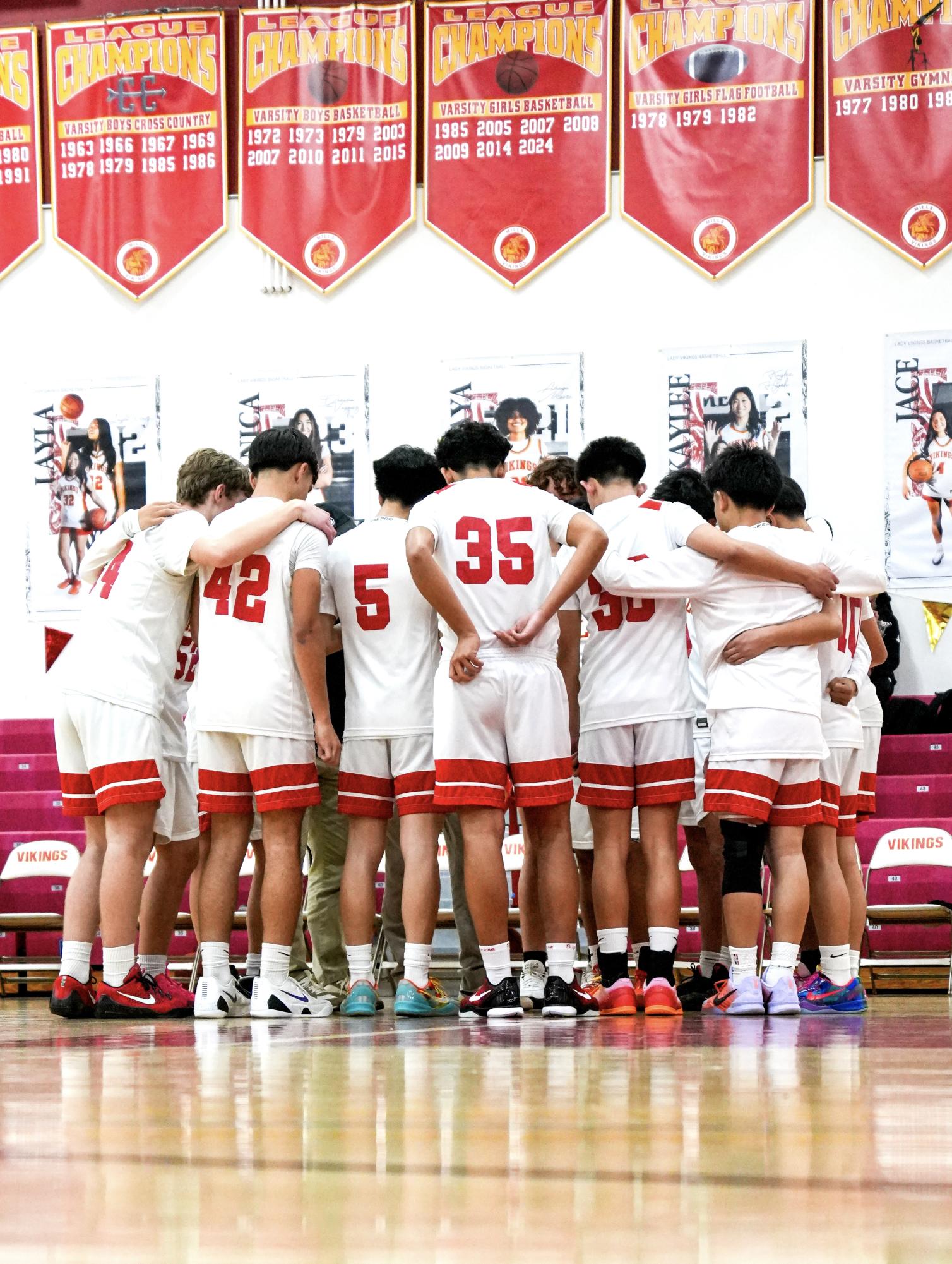 JV boys basketball in their pregame huddle before a game 