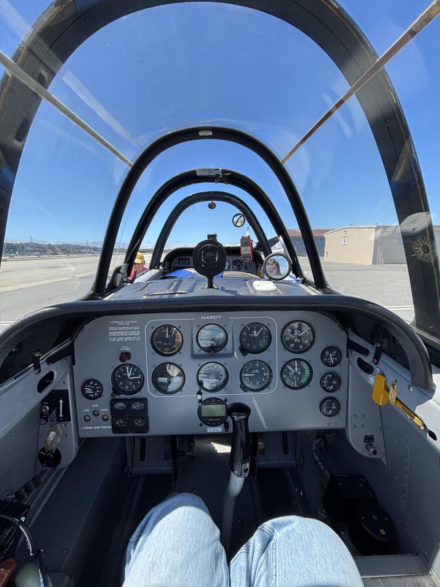 Nicole Li (11) runs a series of checks on the plane in preparation for take off.