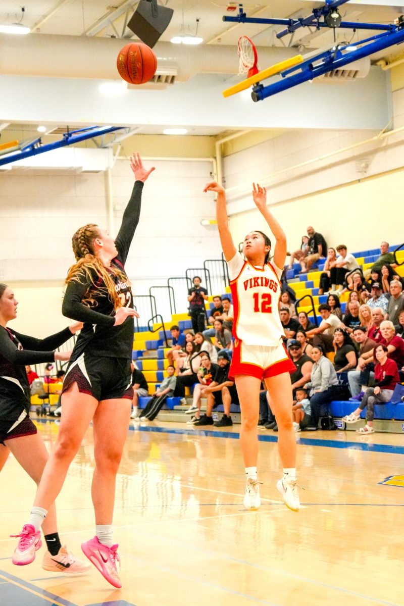 Kaylee Huynh shoots a midrange jumper on the right corner 